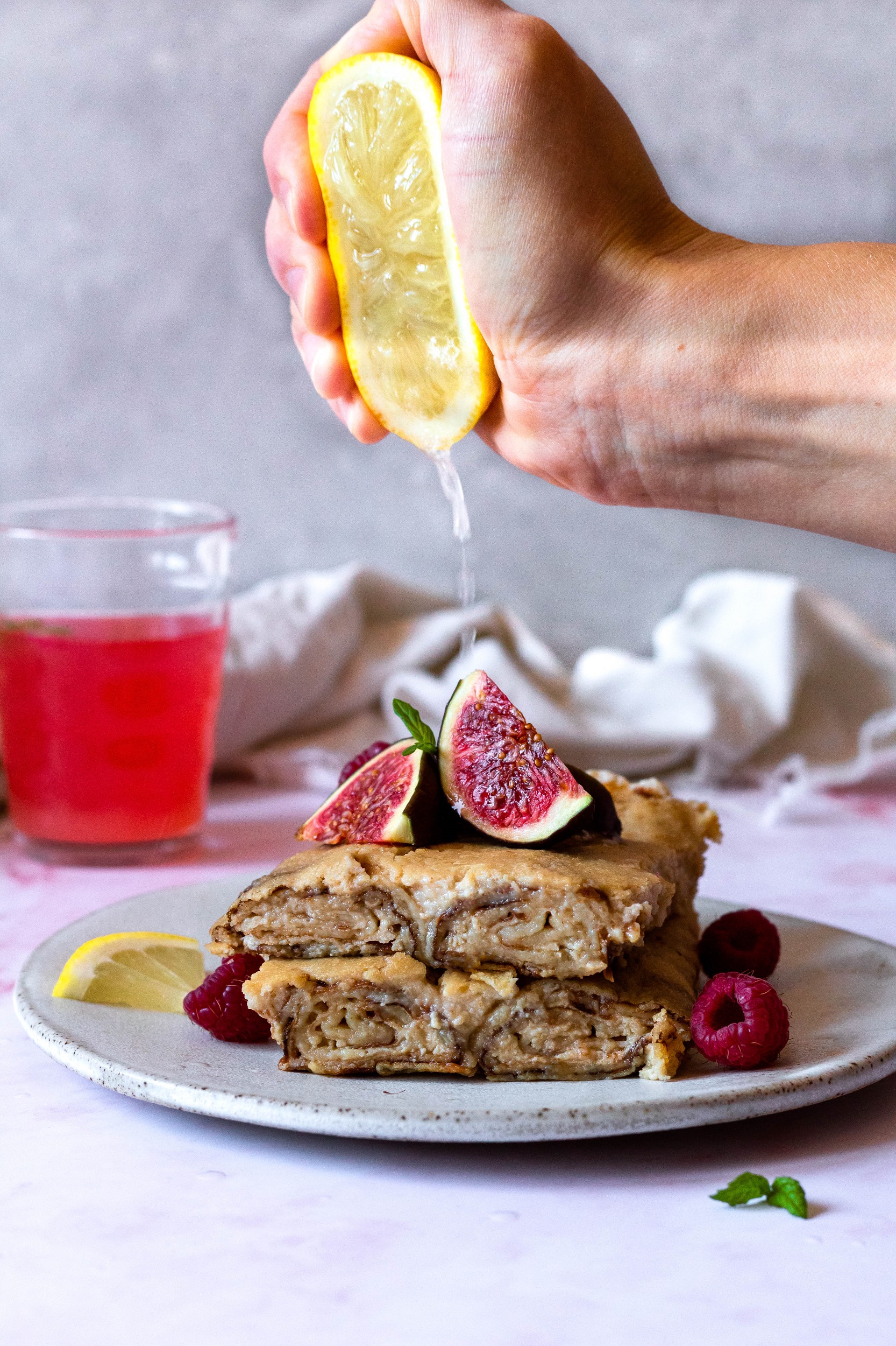 baked sweet crepes with some lemon squeezed over them
